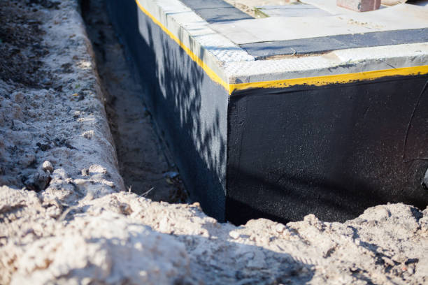 Professional Waterproofing technician working in Hubertus, WI